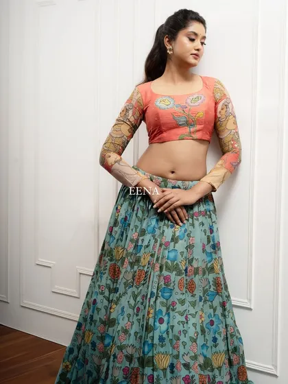 Discover the beauty of traditional craftsmanship with this stunning Pen Kalamkari lehenga. The piece is meticulously hand-painted by my artisans, with a story unfolding on the blouse sleeves and a beautiful floral pattern on the skirt and dupatta.