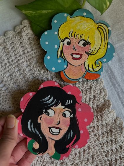 A nostalgic set of magnets featuring Betty and Veronica from the Archie comics, painted in my style.