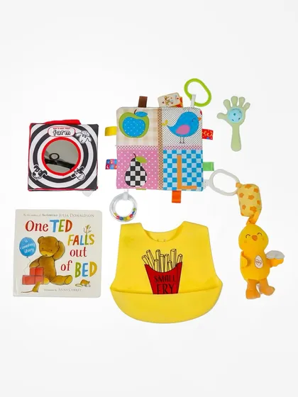 This is a catalogue-style flatlay of baby products, neatly arranged on a clean white background. This format is perfect for e-commerce sites, allowing brands to display multiple items from a collection or gift hamper clearly.