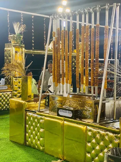 My ornate, golden-themed barbecue counter, featuring impressive hanging Changezi Seekh, ready for a grand event.