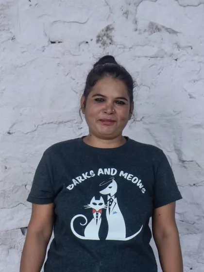 Another one of our dedicated caretakers, Sonu, who has a natural ability to make friends with every dog she meets.