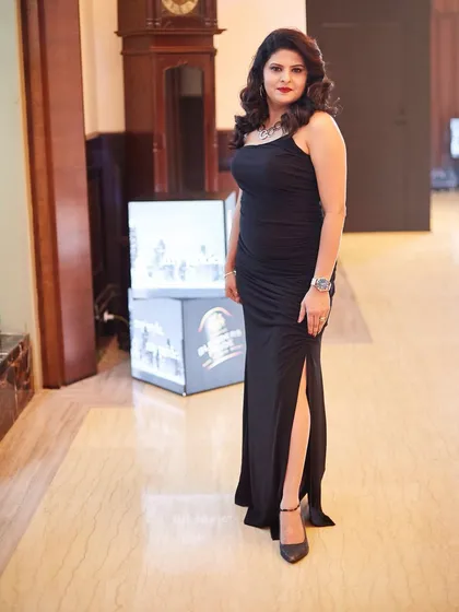 Simple, elegant, and powerful. I designed this classic black spaghetti-strap gown with a thigh-high slit for a formal event, proving that bespoke doesn't always mean traditional.