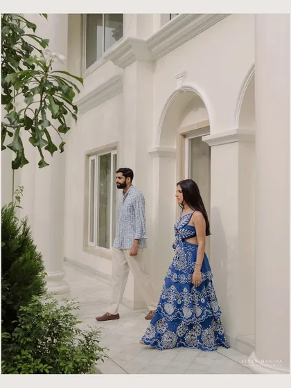 A candid moment captured in a beautiful, light-filled home. This style of pre-wedding photography tells a story of shared lives and quiet companionship.