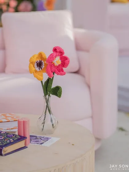 A close-up of the charming, handmade crocheted flowers that added a unique, crafty touch to the "Bloom" wedding decor.