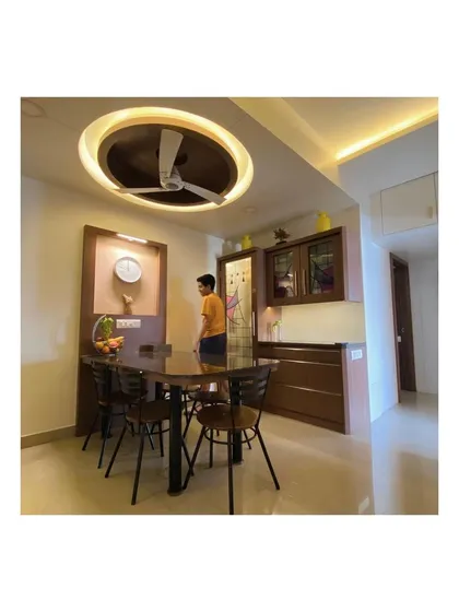 An angled view of the dining and kitchen entrance, showing how we create a cohesive flow between different functional zones in an open-plan living area.