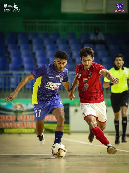 In the heat of the final, our player dribbles past a defender, showcasing skill and composure under pressure.