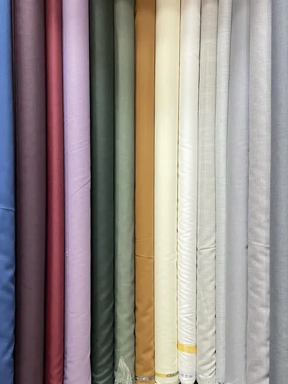 I stock a wide variety of high-quality suiting fabrics from trusted brands like Siyaram and Raymond. You can browse through solids, textures, and patterns to find the perfect material for your suit or blazer.