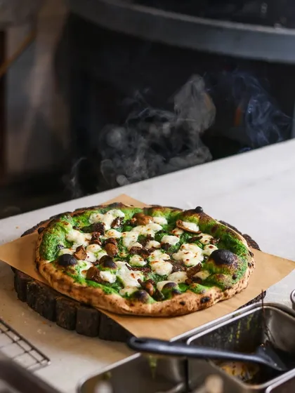 Our Mushroom & Burrata pizza, made with a spinach cream base, is a true showstopper. The earthy mushrooms and creamy burrata create a rich flavor that's perfect for a special meal.