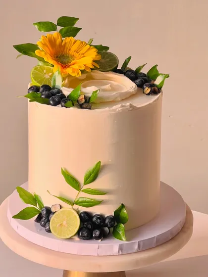 My most popular creation, the signature Italian Lemon & Blueberry cake. I offer many design variations, all featuring fresh blueberries, zesty lime, and smooth buttercream.