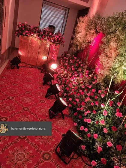 Another view of the party entrance, showing how the floral wall and lighting guide guests into the event space. This setup is ideal for making a grand statement at any celebration.