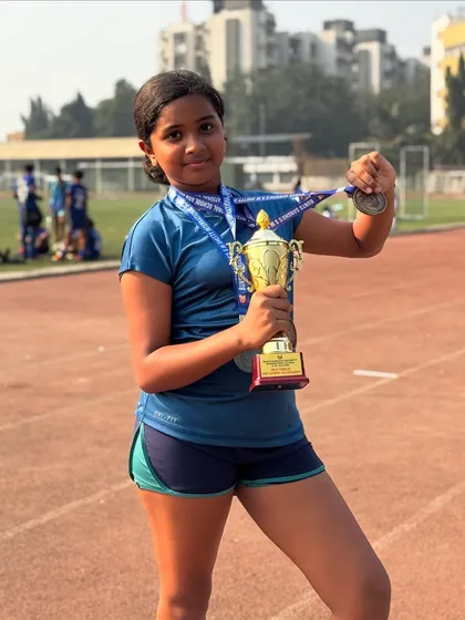 Another shot of champion Zanna Fernandes with her best athlete trophy and three medals. Her powerful performance was truly inspiring.