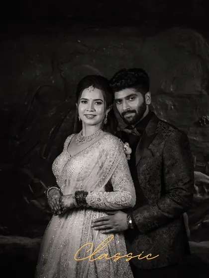 A classic black and white portrait that exudes timeless elegance. This reception shot highlights the couple's sophisticated style, proving that some moments are most powerfully captured in monochrome.