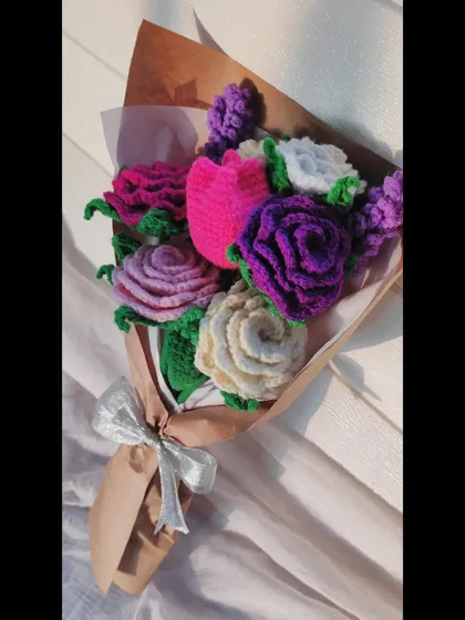This custom bouquet combines roses, tulips, and lavender in shades of purple, pink, and white for a soft and romantic look.