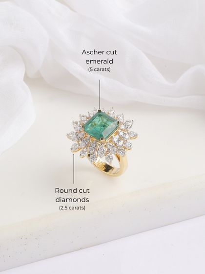 Another view of the Heera Panna ring, emphasizing the emerald that owns the spotlight, framed perfectly by diamonds.