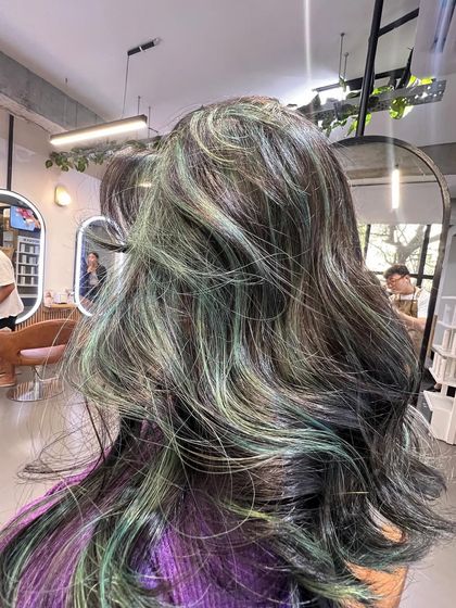 A different angle of the green highlights, showing how they are subtly woven into the hair for a multi-dimensional effect.