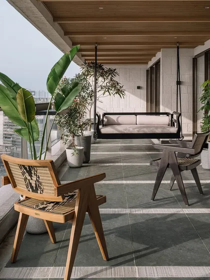 The twenty-one-foot-long sea-facing deck at Kanso House is a true urban sanctuary. We designed this space for togetherness, with a custom swing, lush greenery, and the soothing sound of a water feature, all set against the magnificent Mumbai skyline. It’s a perfect example of how I blend natural materials like Kota stone with the urban environment.