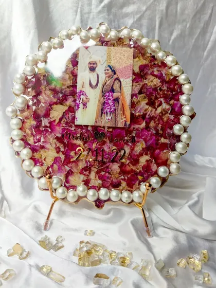 These images and videos showcase various angles and the creation process of my custom wedding and anniversary varmala preservation frames. Each one is made with love to turn your special memories into a timeless treasure.