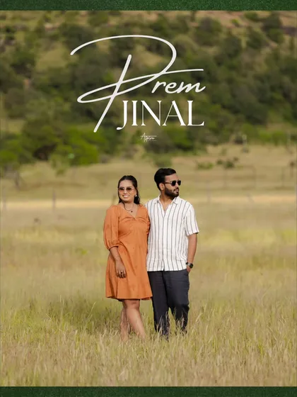 A classic portrait of Prem and Jinal standing in a wide, open field. This image serves as a beautiful 'save the date' style photo, capturing their story in the calmness of nature.