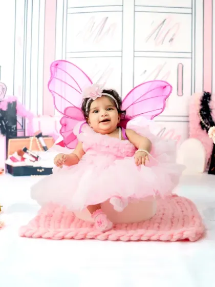 This little fairy-winged Barbie is ready for her close-up. For younger babies, I adapt the theme for sitter sessions, using softer props and comfortable poses.