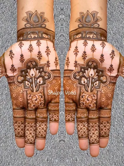 A symmetrical design with a central lotus motif, featuring negative space to create a modern yet traditional feel.
