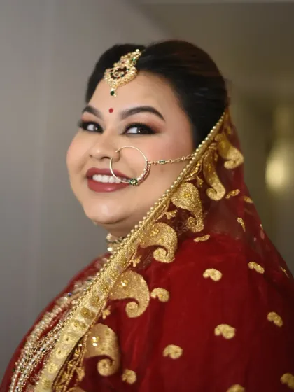 Shreyoshi wanted a classic bridal look for her first wedding anniversary celebration, and she looked absolutely breathtaking. The soft glam makeup with a defined eye and red lip was perfect for her red lehenga.