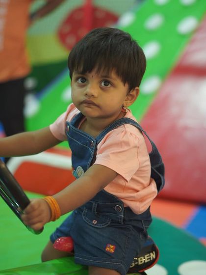 A sweet moment captured in our toddler zone. This area is perfect for little ones to play and explore at their own pace.
