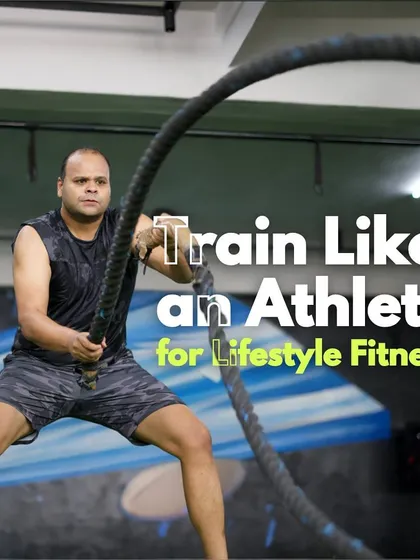 Training like an athlete is the key to sustainable lifestyle fitness. Here, a client performs battle rope exercises, a fantastic tool for building cardiovascular endurance and upper body strength simultaneously.