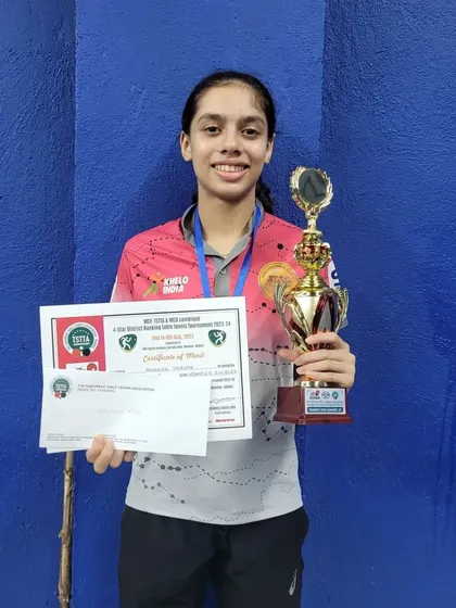 A smiling Ananya Chande with her silver medal trophy and certificate. Every tournament adds to her experience and prepares her for bigger challenges.