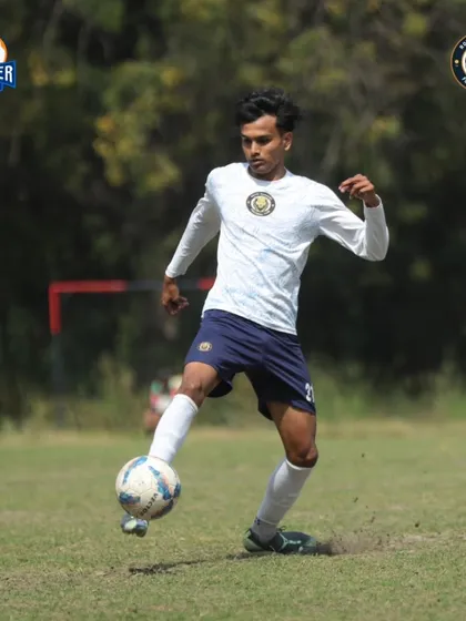 Dribbling with intent. A player drives at the defense, showcasing the attacking mindset we instill in our team.