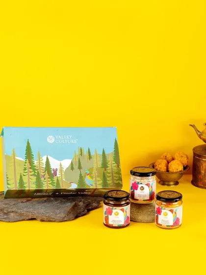 A festive gift box from Valley Culture against a bright yellow background. This image is styled for a celebration like Diwali, positioning the products as a perfect "gift of health."
