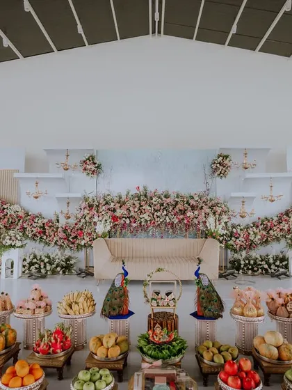 The setting of your celebration is part of its story. I capture the beautiful decor and ambiance you've so carefully planned, from the floral arrangements to the traditional offerings.