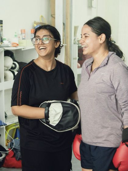 There's always time for a laugh between rounds. The friendships built here are as strong as the punches.