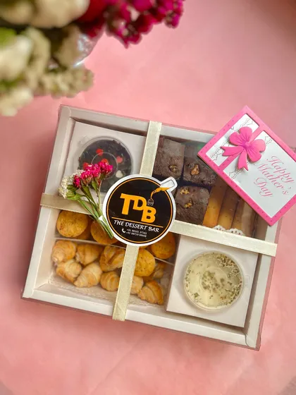 This is my Mother's Day High Tea Hamper, all beautifully wrapped and ready to gift. It’s a complete grazing box designed to make any mom feel cherished and celebrated.