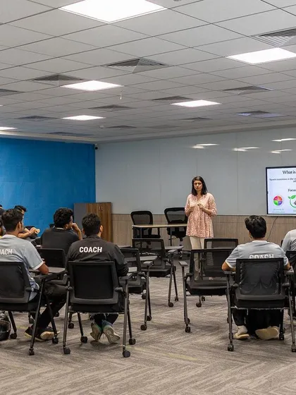 A wide shot of the nutrition workshop for coaches. Creating a culture of wellness starts with educating the educators.