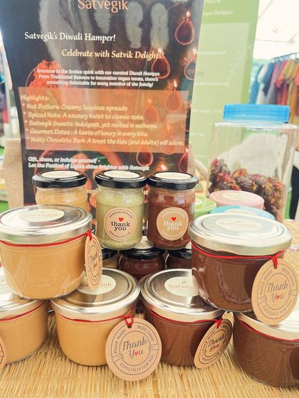 My nut butters displayed at a local market, ready for you to take home. Each jar is sealed with a "thank you" tag, because I'm grateful for every customer who supports my mission.