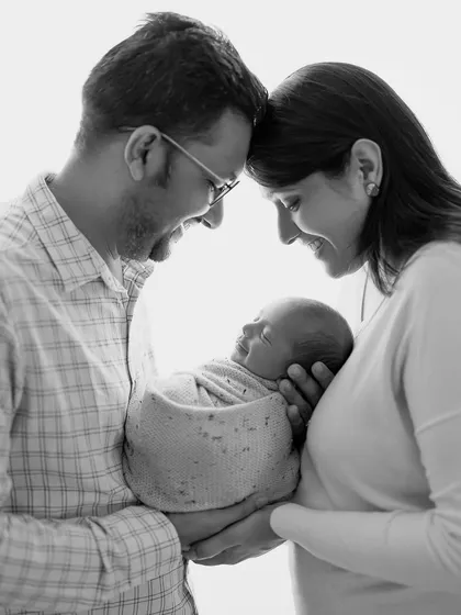 Heartwarming smiles all around. Black and white photography often brings out the raw emotion in a portrait, and the joy here is just radiant.