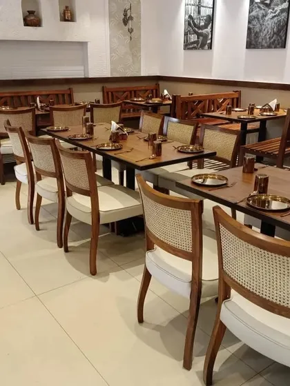 For this restaurant project in Dadar, I supplied all the seating, including these cane-back dining chairs and wooden benches. The goal was to create a durable yet elegant setting for a busy commercial space. I work with many restaurants to provide furniture that can handle heavy use while looking great.