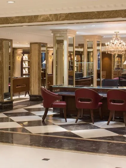We creatively adapted the existing structure of the Anand Jewels building, using its many columns to define distinct retail zones. Mirrored surfaces on the columns and a checkerboard floor pattern create a dynamic play of reflections, enhancing the visual experience.