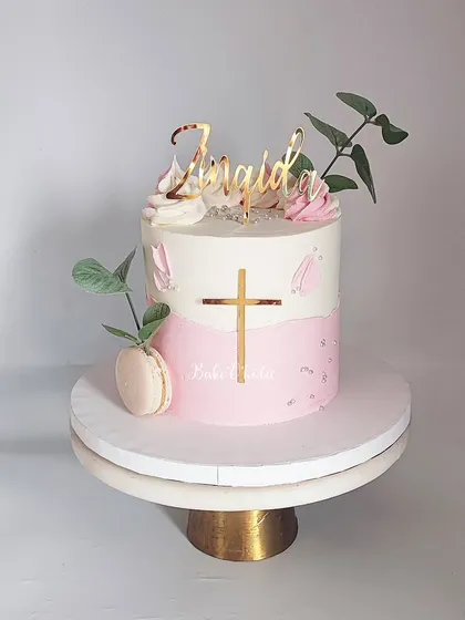 The clean lines and delicate details make this a truly special cake for a blessed occasion.