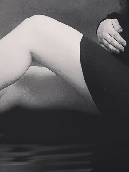 An artistic, close-up black and white shot focusing on the beautiful curves of pregnancy. This type of abstract maternity photo is both modern and timeless.