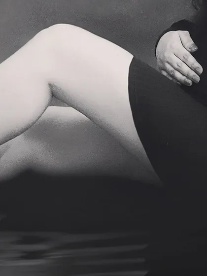 An artistic, close-up black and white shot focusing on the beautiful curves of pregnancy. This type of abstract maternity photo is both modern and timeless.