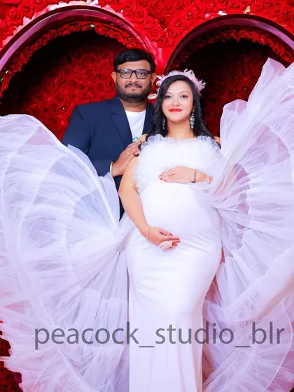 A lovely couple's maternity photo. I provide coordinated outfits and beautiful backdrops to create cherished memories before your little one arrives.