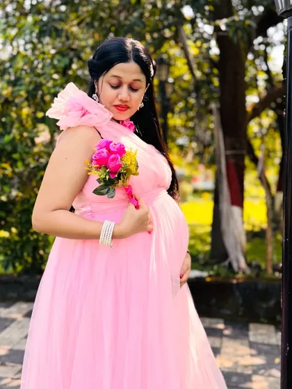 Celebrate your special journey with a beautiful maternity photoshoot. I have gorgeous flowing gowns like this pink tulle one, with rentals starting at just ₹999.