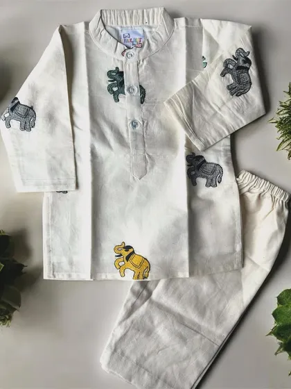 I love adding playful details to my boys' outfits. This off-white cotton kurta set features cute little embroidered elephants, making traditional wear fun for your little man. It’s simple, soft, and perfect for any celebration.