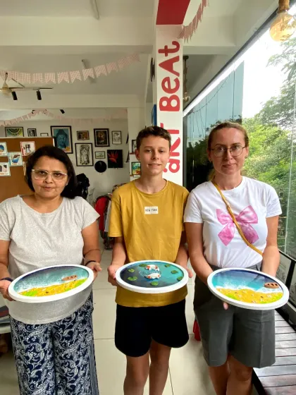 A family proudly displays the resin art they created together. My workshops are suitable for all ages and make for a fun family outing.