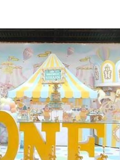 A cropped view of the main stage, showing the beautiful carnival backdrop and the large 'ONE' sign.