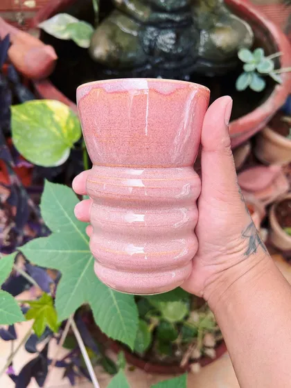 A ribbed pink tumbler, fresh from the kiln. The glaze has a beautiful speckled effect that I love.
