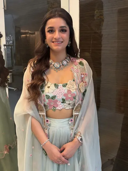 The client looks radiant and happy. The half-up style is a great choice as it's comfortable, stylish, and suits almost everyone.