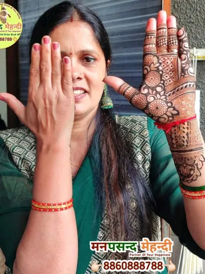 A happy client showcasing her beautiful full-hand design. Her smile is a testament to the quality of our work and service.
