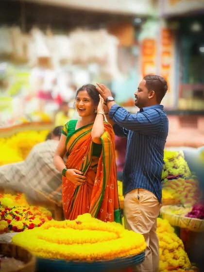 A candid and playful pre-wedding moment in a bustling Bangalore flower market. We love finding unique locations that reflect the couple's personality and create authentic, story-driven photographs.